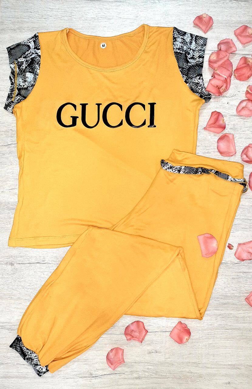 Pantalón largo multimarcas mostaza Gucci
